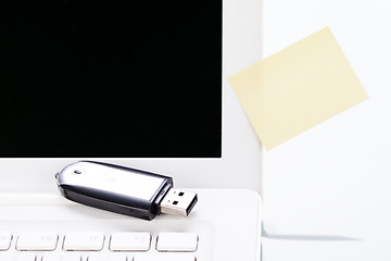 Image showing notebook laptop with post it memo and usb stick 