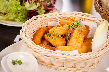 Image showing Crumbed chicken nuggets in a basket