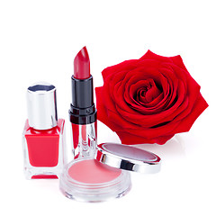 Image showing Fashionable cosmetics with a fresh red rose