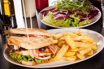 Image showing Club sandwich with potato French fries