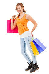 Image showing attractive young woman with colorful shopping bags