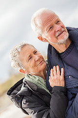 Image showing happy elderly senior couple walking on beach