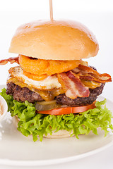 Image showing Delicious egg and bacon cheeseburger