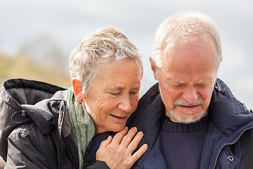 Image showing happy elderly senior couple walking on beach