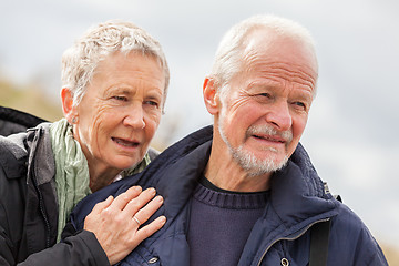 Image showing happy elderly senior couple walking on beach