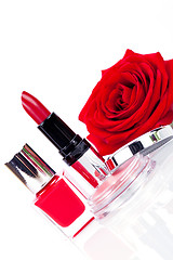 Image showing Fashionable cosmetics with a fresh red rose