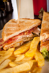 Image showing Club sandwich with potato French fries