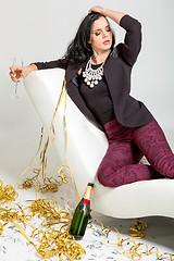 Image showing Seductive brunette holding a glass of champagne