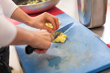 Image showing Chef chopping salad ingredients