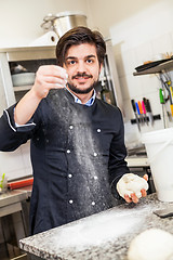 Image showing Chef tossing dough while making pastries