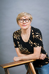 Image showing Attractive blond senior woman wearing glasses