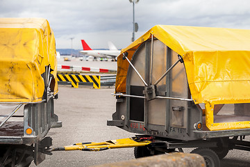 Image showing Trolleys loaded with luggage at an airport