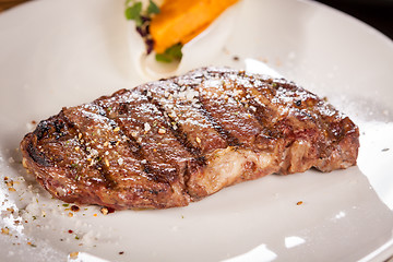 Image showing Grilled beef steak with seasoning