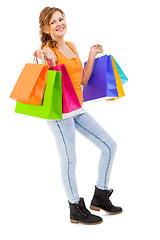 Image showing attractive young woman with colorful shopping bags