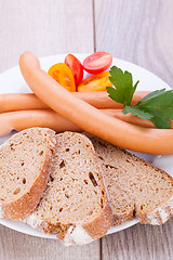 Image showing tasty sausages frankfurter with grain bread 