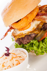 Image showing Delicious egg and bacon cheeseburger