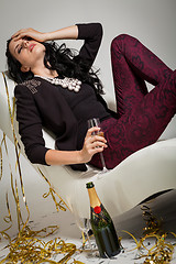 Image showing Seductive brunette holding a glass of champagne