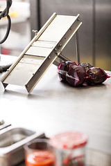 Image showing Chef slicing boiled beetroot