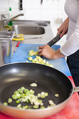 Image showing Chef chopping salad ingredients