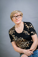 Image showing Attractive blond senior woman wearing glasses