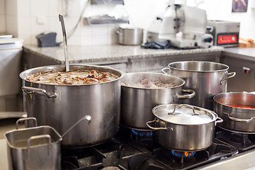 Image showing Cooking in a commercial kitchen