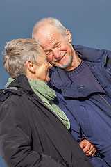 Image showing happy elderly senior couple walking on beach