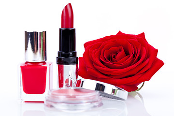 Image showing Fashionable cosmetics with a fresh red rose