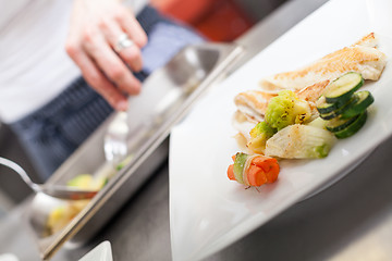 Image showing Fried fish fillets and vegetables