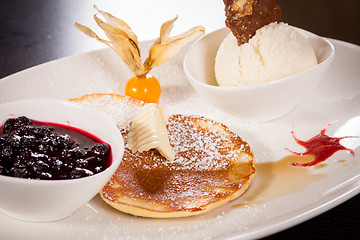 Image showing tasty sweet pancakes with vanilla icecream and topping