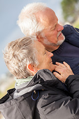 Image showing happy elderly senior couple walking on beach