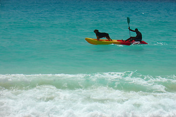 Image showing Dog in the boat on the sea