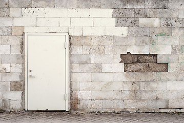 Image showing metal door and brik wall