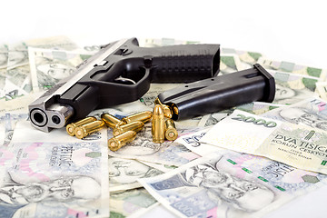 Image showing gun with bullet on czech banknotes