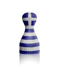 Image showing Wooden pawn with a painting of a flag