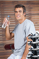 Image showing Happy Man Drinking Water From Bottle At Health Club