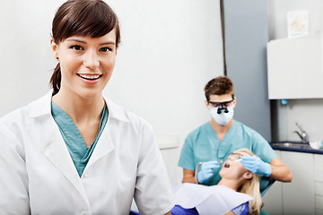 Image showing Female Assistant With Dentist Working In The Background