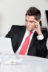 Image showing Thoughtful Businessman Working At Desk