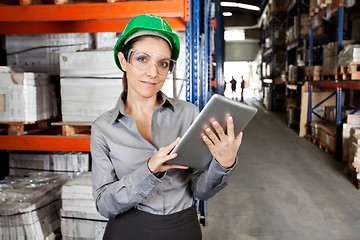 Image showing Female Supervisor Using Digital Tablet At Warehouse