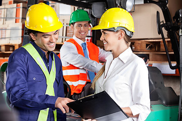 Image showing Supervisor Communicating With Foreman At Warehouse