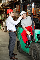 Image showing Supervisor Instructing Forklift Driver