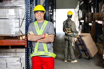 Image showing Mid Adult Foreman With Arms Crossed At Warehouse