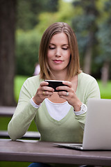 Image showing Woman in Park with Mobile Phone