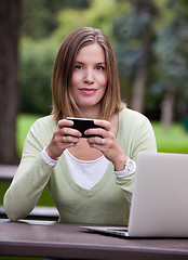 Image showing Portrait of Woman in Park with Mobile Phone