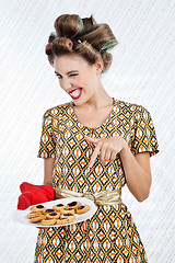 Image showing Woman Winks As She Holds Plate Of Cookies