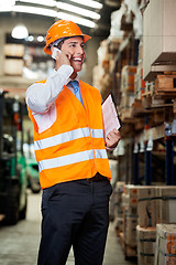 Image showing Supervisor Using Cell Phone At Warehouse