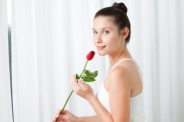 Image showing Young Woman with a Rose