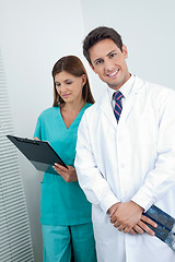 Image showing Doctor And Dental Nurse With Reports