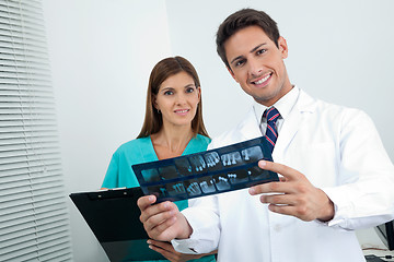 Image showing Doctor And Assistant With Patient's Report