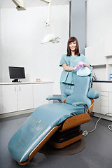 Image showing Female Dentist Standing By Dental Chair At Clinic