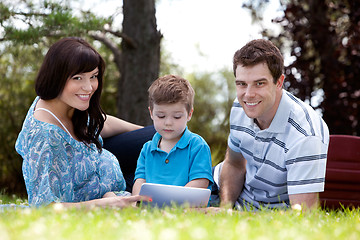 Image showing Young Boy With Parents in Park